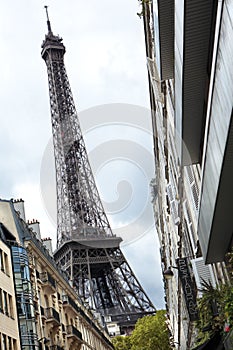 Eiffel Tower paris france viewed from busy Paris street.