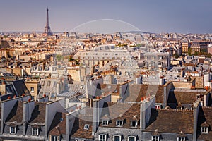 Eiffel tower and parisian roofs at clear sky sunrise Paris, France