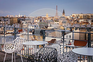 Eiffel tower and parisian roofs at sunrise Paris, France