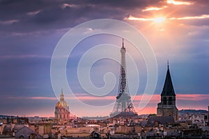 Eiffel tower and parisian roofs at sunrise Paris, France