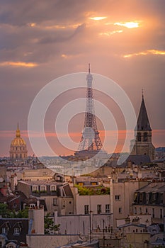 Eiffel tower and parisian roofs at sunrise Paris, France