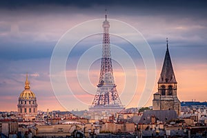 Eiffel tower and parisian roofs at sunrise Paris, France