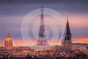 Eiffel tower and parisian roofs at sunrise Paris, France