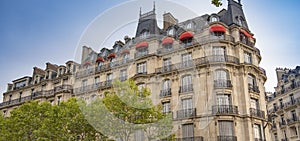 Eiffel tower between Parisian tenement old street alley and buildings