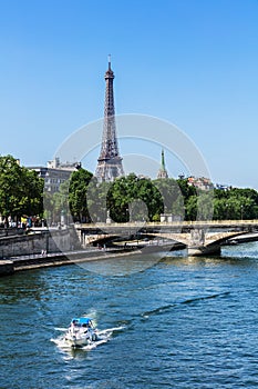 Eiffel Tower and River Seine with cruise tour boat. Paris, Franc