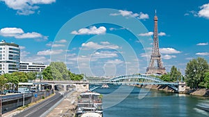 Eiffel tower at the river Seine timelapse from bridge in Paris, France