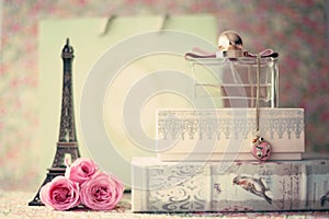 Eiffel tower with roses and perfume bottle photo