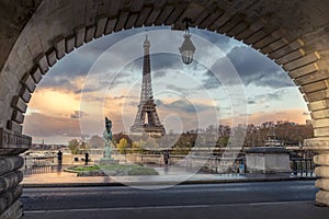 Eiffel tower seen from arch of Bir Hakeim bridge in Paris