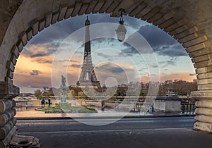 Eiffel tower seen from arch of Bir Hakeim bridge in Paris