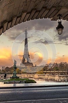 Eiffel tower seen from arch of Bir Hakeim bridge in Paris