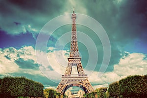 Eiffel Tower seen from Champ de Mars park in Paris, France. Vintage