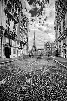 Eiffel Tower seen from the street in Paris, France. Black and white