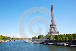 Eiffel tower and Seine river in a clear sunny day in Paris