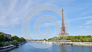 Eiffel Tower and Seine river in Paris in a sunny day in France