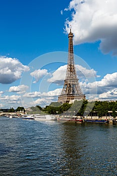 Eiffel Tower and Seine River with White Clouds in Background