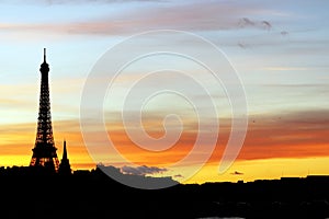 Eiffel tower silhouette during a Parisian sunset from Alexandre III bridge