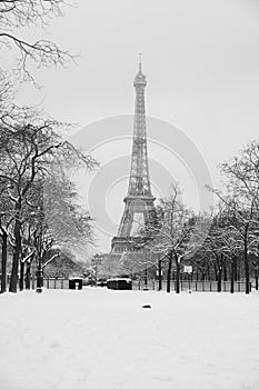 The Eiffel Tower snowday with far walkers