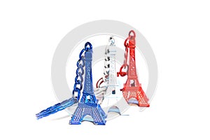 Eiffel tower souvenir keychains in colors of flag of France.