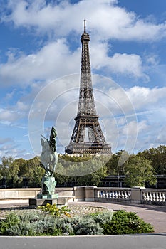 Eiffel tower with Statue of La France Renaissante, Paris, France