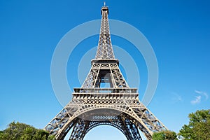 Eiffel tower, sunny summer day with blue sky in Paris