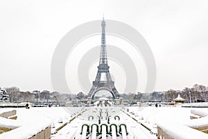 The Eiffel tower and Trocadero fountain on a snowy day in Paris, France