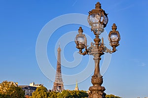 Eiffel tower view from the Pont Alexandre III bridge over the Seine river, Paris. France