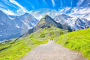 Eiger, Monch and Jungfrau peaks from Mannlichen in Swiss Alps