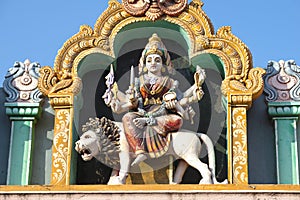 Eight-armed goddess Durga riding a lion