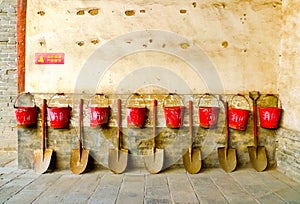 Eight fire buckets hung on a wall