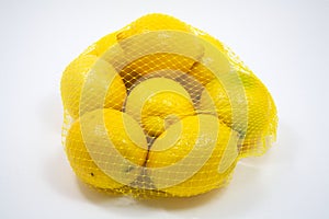 Eight fresh lemons in a bag