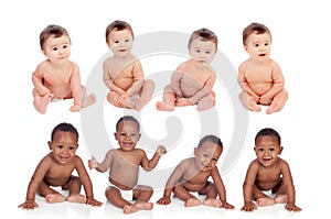Eight funny babies sitting on the floor