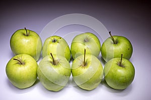 Eight green apples