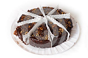 Eight piece of chocolate cake with walnuts.