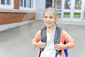 Eight years old school girl close to the schoolyards