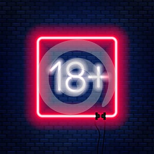 Eighteen plus neon sign on brick wall background.