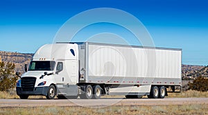 Eighteen wheel big rig tractor with trailer on highway. Trucking industry