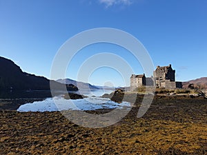 Eilean Donan Castle Against a Bright Blue Sky