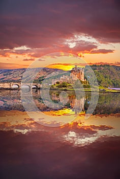 Eilean Donan Castle against sunset in Highlands of Scotland