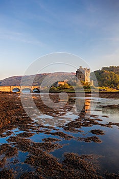 Eilean Donan Castle against sunset in Highlands of Scotland