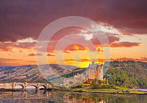 Eilean Donan Castle against sunset in Highlands of Scotland