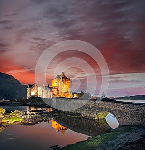 The Eilean Donan Castle with colorful sunset, Highlands of Scotland