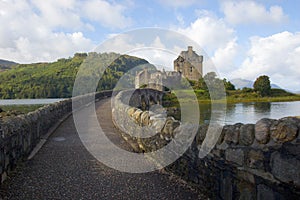 Eilean Donan castle and bridge path from scenic lookout Scotland photo