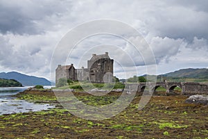 Eilean Donan Castle, Scotland at low tide with dramatic skies