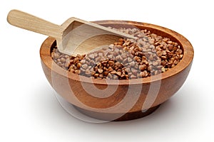 Einkorn wheat in wooden bowl isolated on white