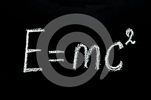 Einstein`s formula drawn on chalkboard