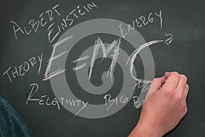 Einstein`s relativity formula and some related concepts written on a blackboard