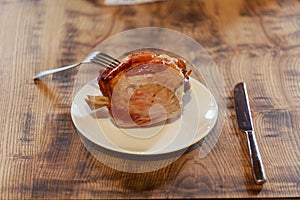 Eisbein pickled ham hock on a white plate