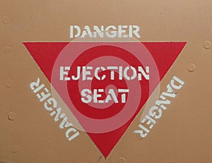 Ejection seat warning red triangle sign