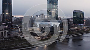 Ekaterinburg city center with Iset River and Yeltsin Center. Stock footage. Aerial view of cityscape with the city pond