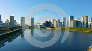 Ekaterinburg, Russia, a pond with a bridge in a new park. Video. Aerial view of a beautiful city district with colorful